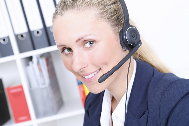 A call center agent wearing a noise cancelling headset