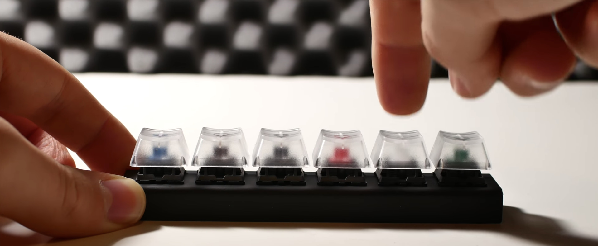 Blue, brown, black, red, white and green mechanical keyboard switches.